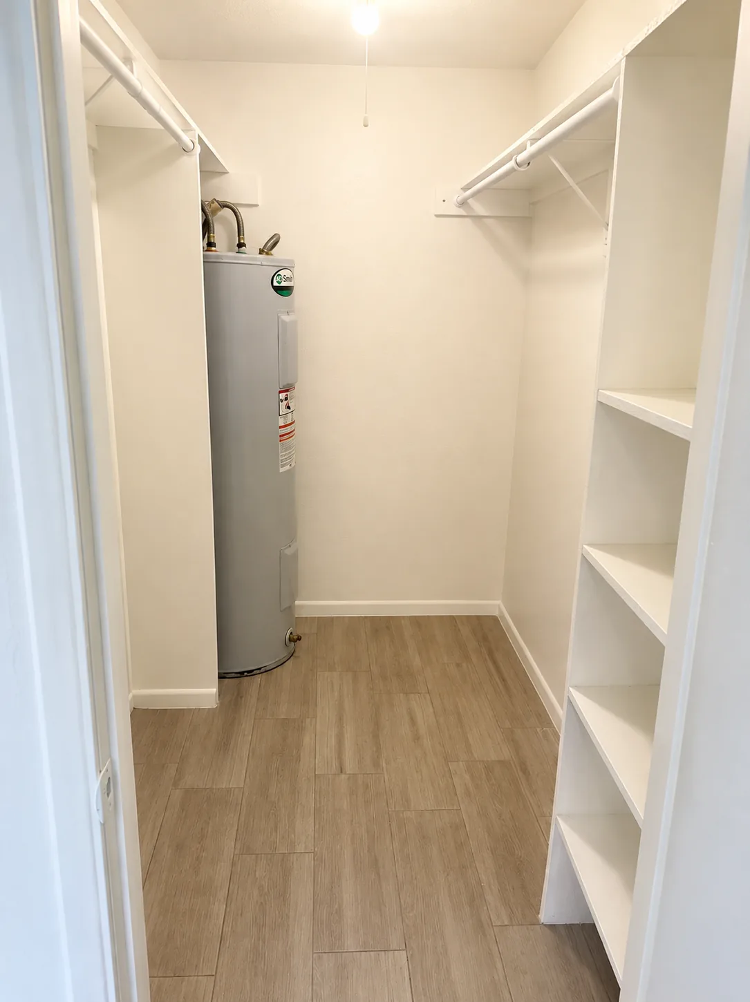 Walk-in closet; furnishings and finishes vary by apartment
